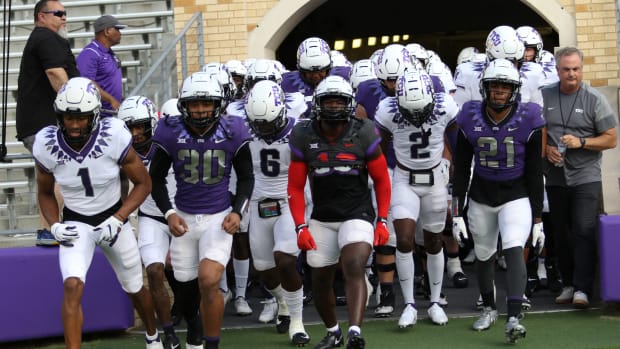TCU Spring Football Game Players Running From The Tunnel